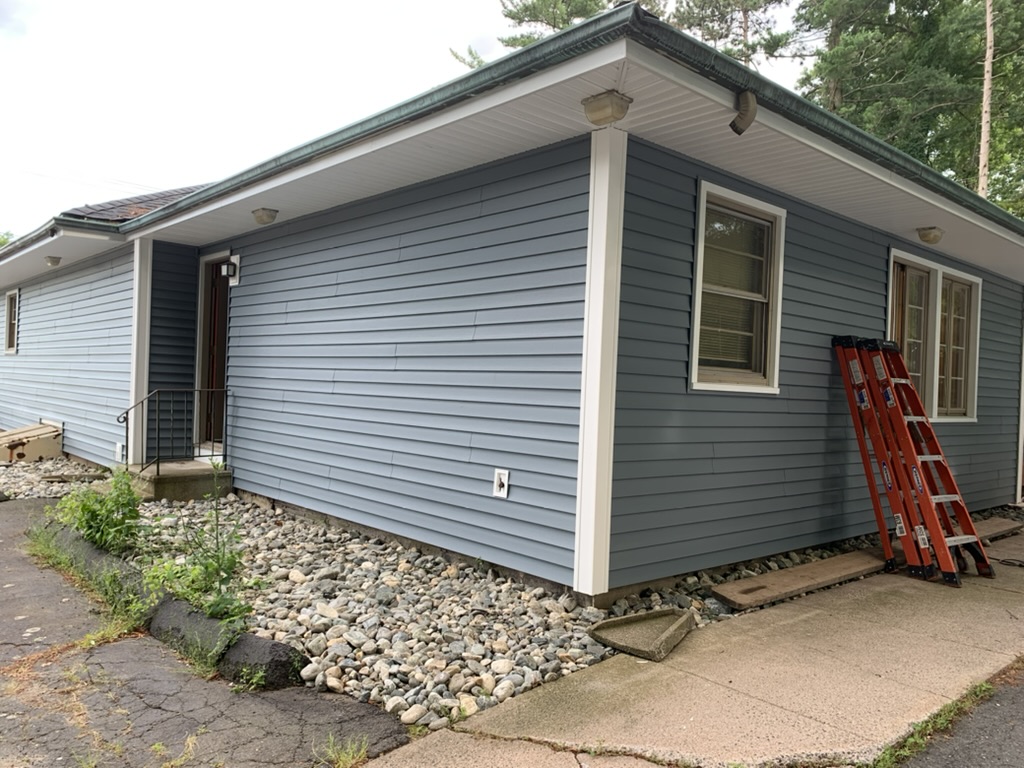 Front of 10 George Avenue after re-siding, white trim and entry with handrail