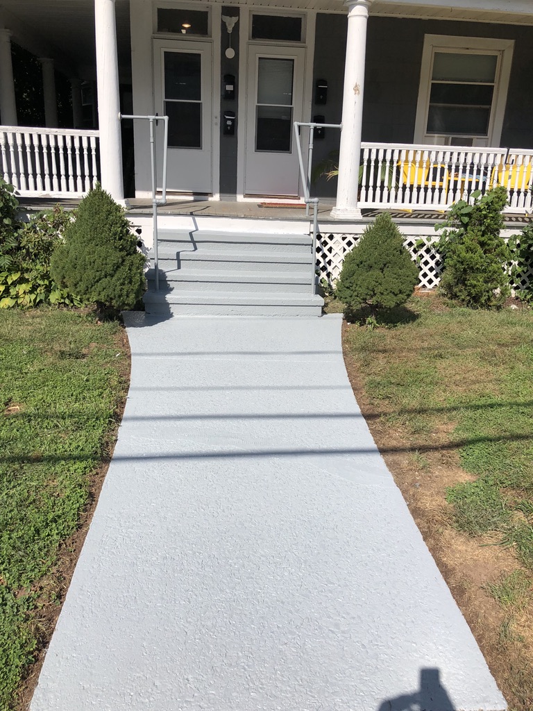 Freshly painted concrete walkway leading to the renovated 31 Wallace Street porch